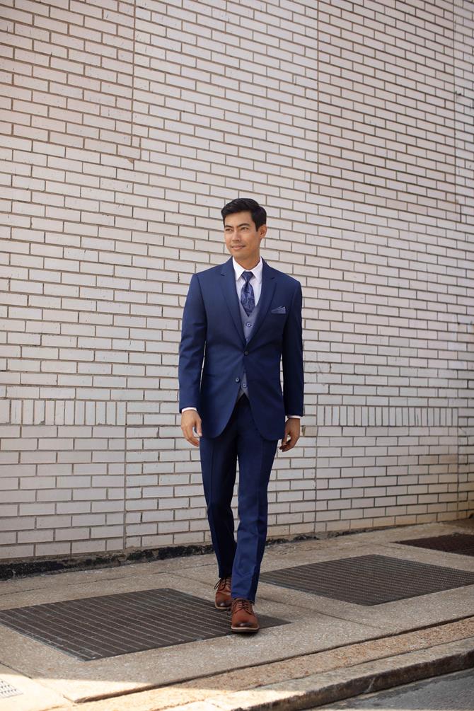 Michael Kors Blue Performance Wedding Suit in an ultra slim fit, offering a modern blue wedding look as an alternative to classic black formalwear.